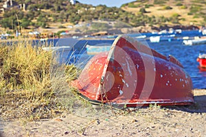 Old red boat on marinas coast