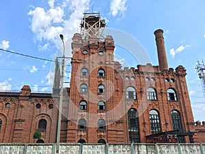 Old red brick building of malting plant at Maikop brewery photo