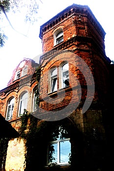 Ancient brick building, the ruins of ancient architecture. Brick tower. An old brick tower rises to the sky.