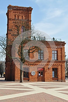 Old red brick building with a tenement tower in the old town