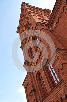 Old red brick building with a tenement tower in the old town