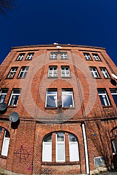 Old red brick building wide angle fisheye view