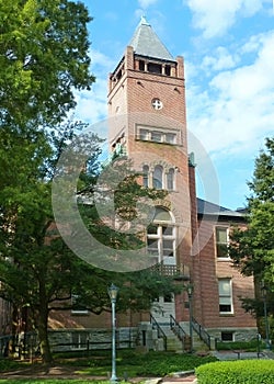 The old red brick courthouse in Montgomery County, Maryland on a summer day