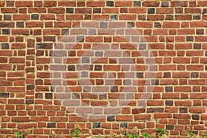 Old red brick fortress wall with gray cement mortar textute