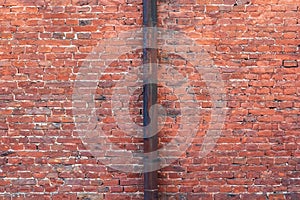 Old red brick wall background.