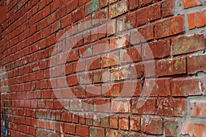 Old red brick wall in a background image. Texture background. Vintage