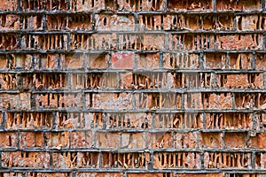 old red brick wall collapses under the influence of weathering, erosion eolation