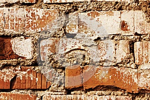 Old red brick wall with cracks and scuffs, style loft background