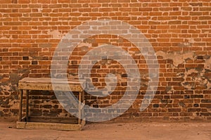 Old red Brick wall design and Wooden old bench