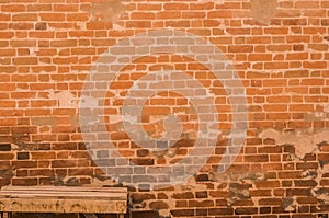 Old red Brick wall design and Wooden old bench