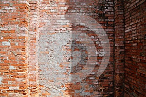 Old red brick wall of La Vang church, with a darker half