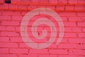 Old red brick wall painted with fresh paint. Brickwork with uneven seams texture of the design background in the loft