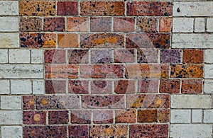 Old red brick wall pattern with white brick border.