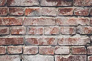 Old red brick wall in rustic style. Cement wall, grunge texture. Brown backdrop wallpaper. Rough vintage cracked brickwork.