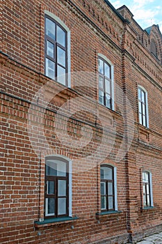 Old red brick wall with Windows