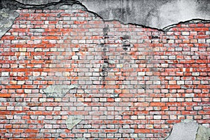 Old red brick wall texture with cracked concrete stucco layer background