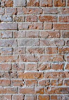 Old red brick wall. Vertical background, loft interior