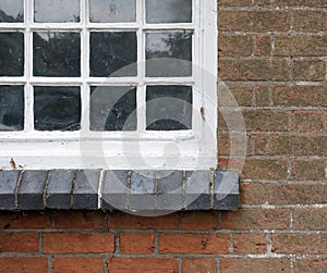 Old Red Brick Wall with White Cottage Window