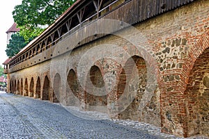 Old red bricks defence wall on Strada Cetatii Citadel Street in the historical center of the Sibiu city in Transylvania