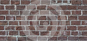 Old red bricks and white cement, wall texture