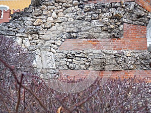 Old red brickwork. Layers of stones. Ancient work. Kremlin wall. Historical place