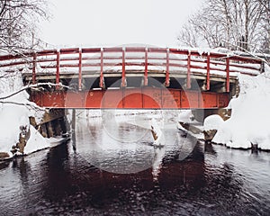 Old red bridge in winter