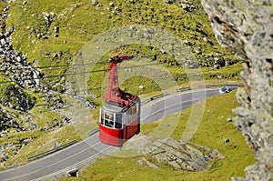 Old red cable car in the mountains