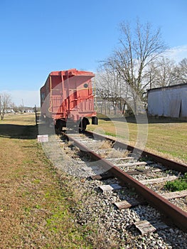 Old red caboose on railway