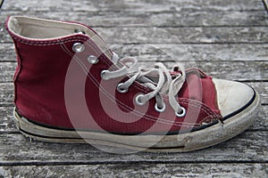 Old red canvas shoe