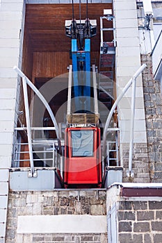 Old red car lift ready for poisoning