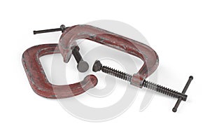 Old red clamp isolated on white background - 3D render
