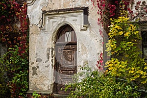 Old red door in the autumn park, Koenig Palace, Ukraine