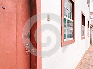 Old red door in baroque rococo colonial city of ouro preto, Brazil