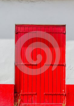 Old red Door on White Wall