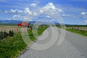 Old Red Farm Equipment in Country Farm Field