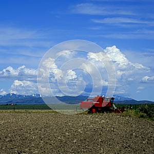 Old Red Farm Equipment in Country Farm Field