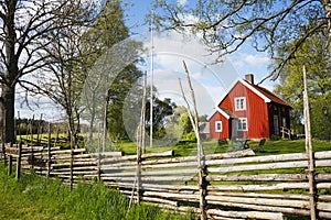 Old red farm in a rural landscape