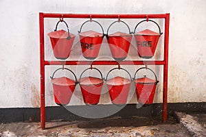 Old red fire buckets