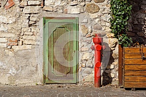 Old red fire hydrant in the street. Fire hidrant for emergency fire access