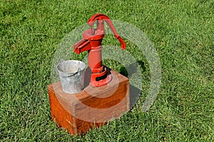 Old red hand powered pump