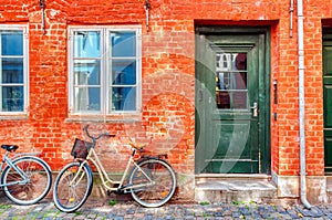 Old red house in the center of Copenhagen with bicycle. Old Medieval district in Copenhagen, Denmark