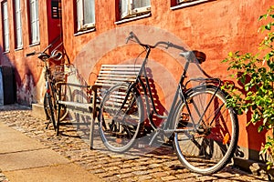 Old red house in the center of Copenhagen with bicycles. Old Medieval district in Copenhagen, Denmark