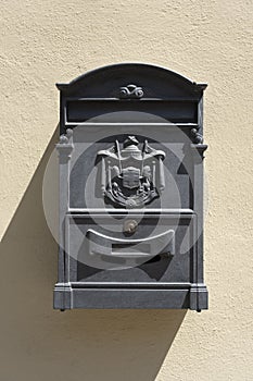 Old red Italian mail box on a wall