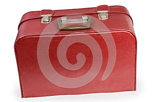 Old red leather substitute hardshell suitcase on a white background