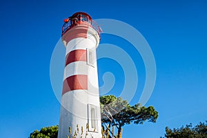 Old red lighthouse in La Rochelle harbor, France