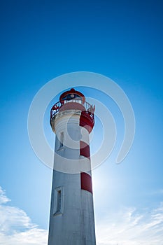 Old red lighthouse in La Rochelle harbor, France