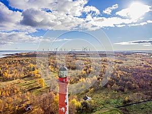 Old red Lighthouse in Paldiski, Estonia staying on a seacoast of