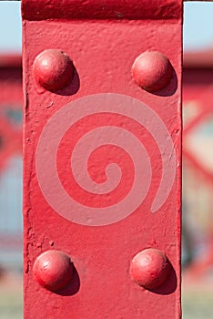 Old red metal background with rivets