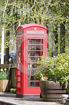 Old red pillar box on train platform