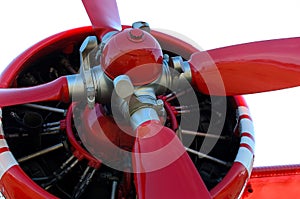 Old red propeller airplane piston engine